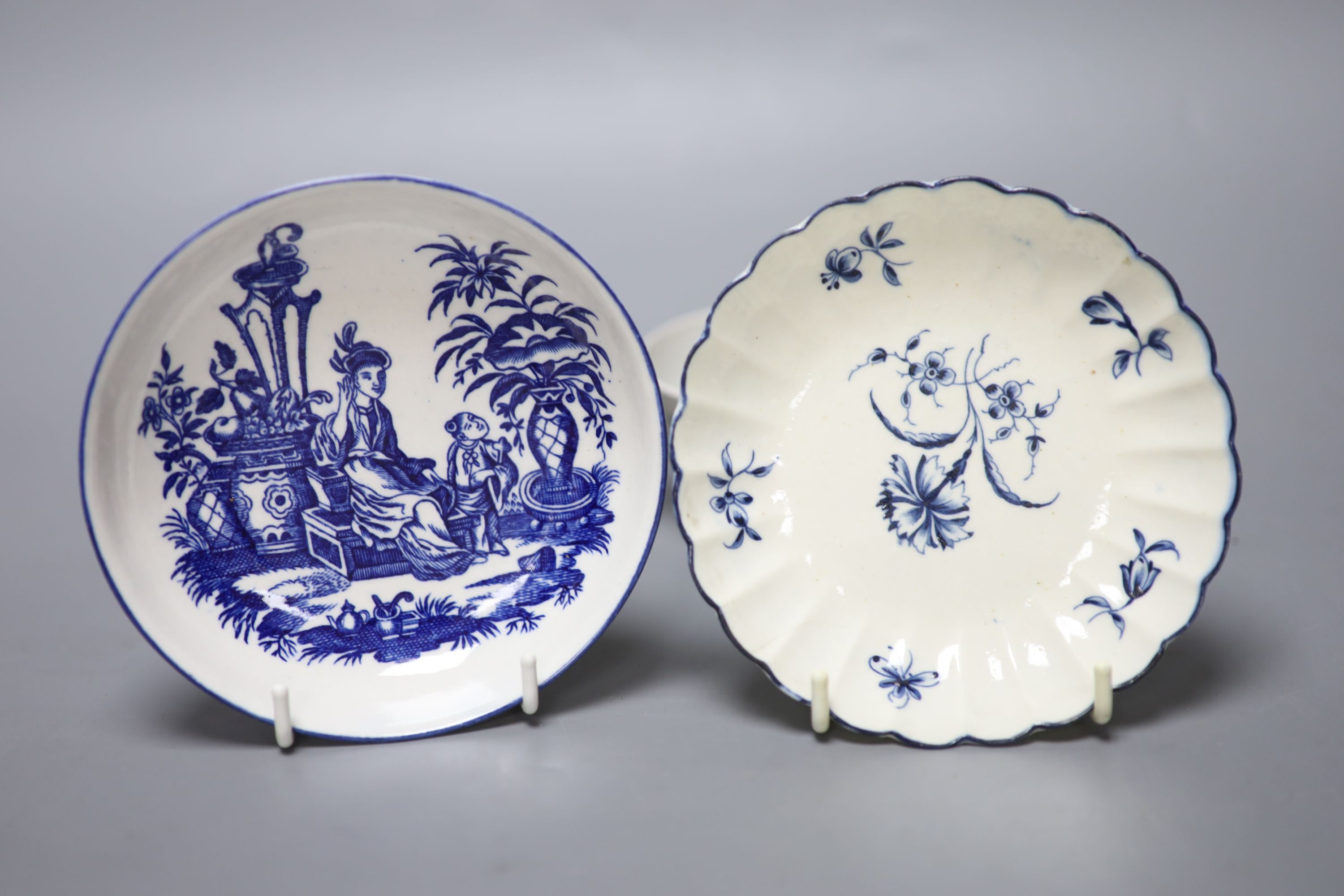 An 18th century Worcester teabowl and saucer Gilliflower pattern and another with mother and child pattern, all with crescent marks